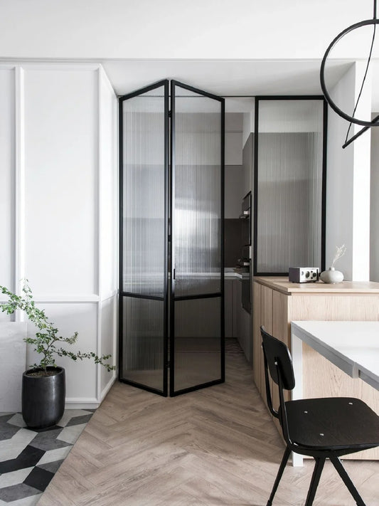 Rothnow aluminum 16x45 series bi-fold folding door with slim frame and waved clear glass, white finish, open position showing interior view.