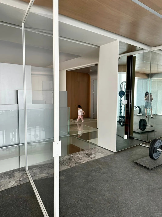 Rothnow aluminum pivot gym door with clear glass skin, white finish, measuring 820mm W x 2220mm H, part of the 16x45 series.