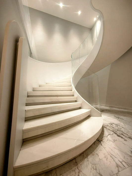 Rothnow® curved stone staircase with black finish, custom-sized, showcasing elegant, smooth curved steps and sturdy railings.