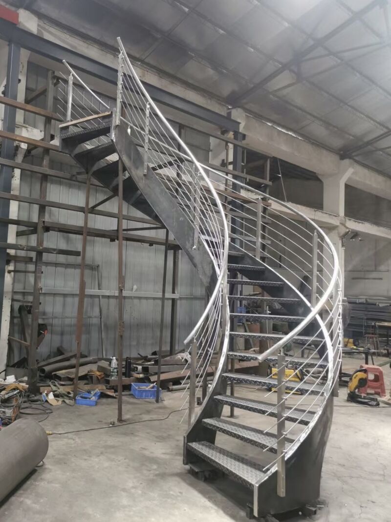 Black Rothnow curved staircase for outdoor use, showcasing custom-sized stairs with elegant, smooth curves and sturdy construction.
