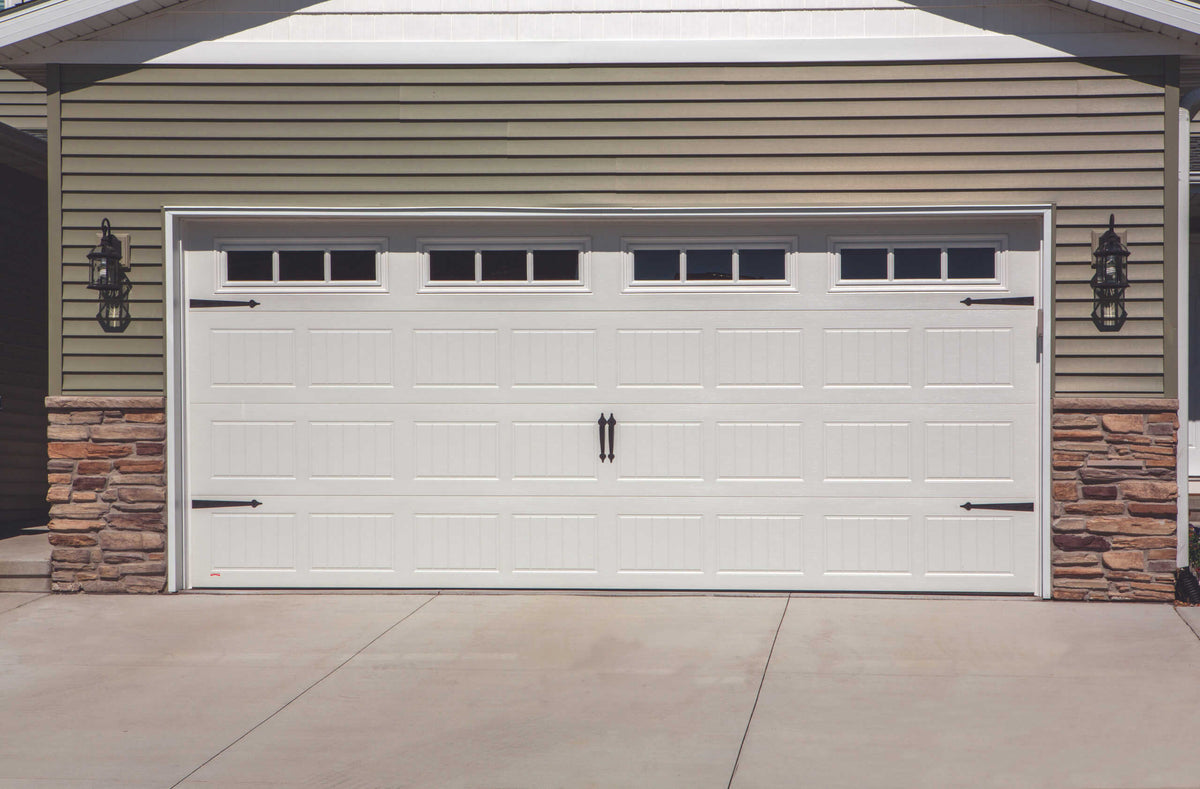 Rothnow black steel garage door with steel plates and filled polyurethane foam insulation, custom-sized for durability and insulation.