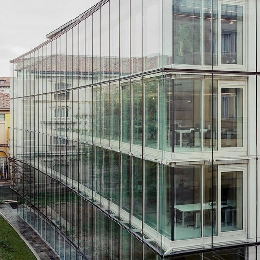 Rothnow® Glass Curtain Wall RNGC08 with exposed black aluminum frame, large clear glass panels for modern building facade.