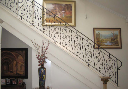 Black Rothnow wrought iron railing and fence with decorative ironwork, custom-sized for outdoor safety and aesthetic enhancement.