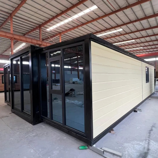 Black Rothnow® Prefab House RNPH07 expandable steel structure building with large windows and modern design.
