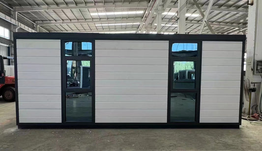 Black Rothnow Prefab House RNPH08 expandable steel structure building with modern design and large windows.