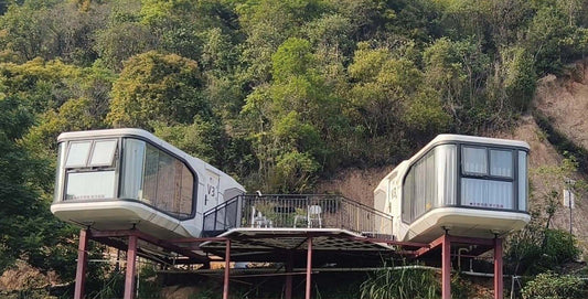 Black Rothnow Space Capsule House, steel structure building, RNSH01-V3 model, modern compact design, large windows, outdoor setting