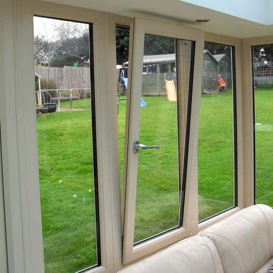 Black Rothnow UPVC Vinyl Tilt & Turn Window with open sash, 24x36 inches, installed in a modern interior.