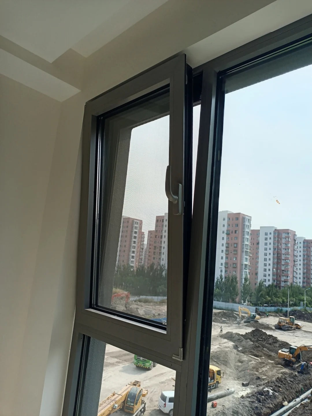 Black UPVC tilt and turn window by Rothnow, 24x36 inches, with openable tilt and turn sash, suitable for modern home installation