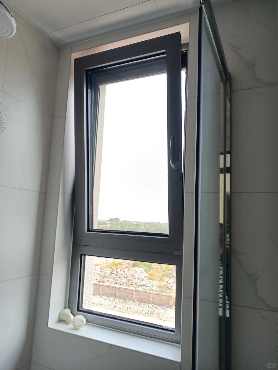 Black Rothnow UPVC vinyl tilt and turn window with open sash, 24 x 36 inches for versatile home ventilation and light.