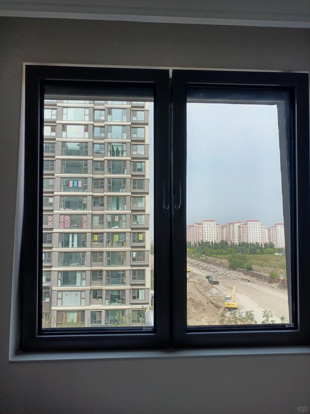 Rothnow UPVC vinyl tilt and turn window in black, 24x36 inches, with openable sash and tilt function for ventilation.