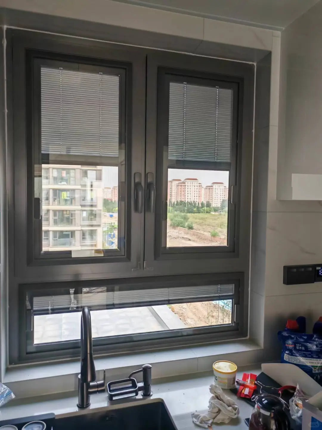 Rothnow UPVC vinyl tilt and turn window in black, 24x36 inches, with open tilt and turn window design, showcasing modern window style