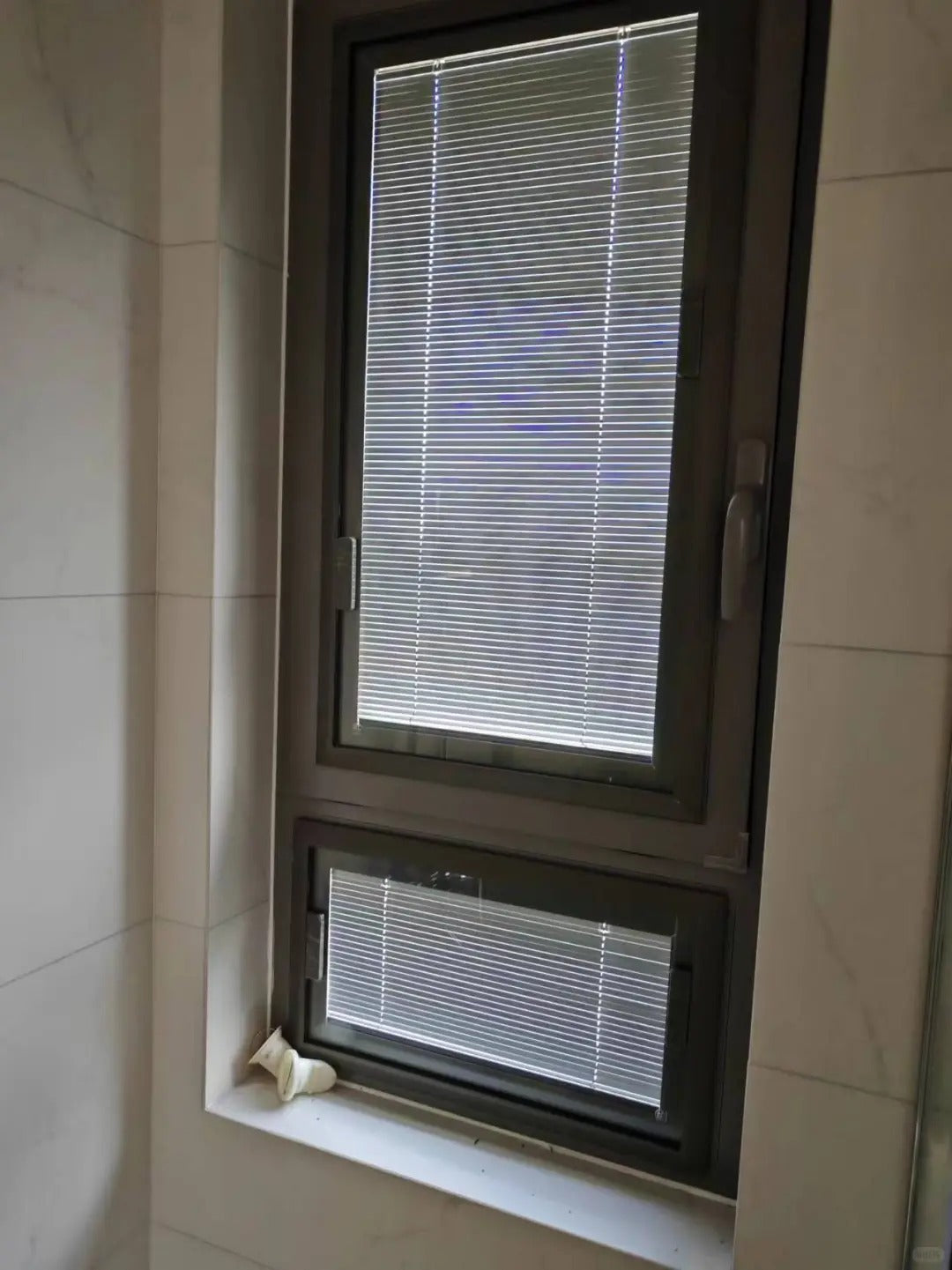 Rothnow UPVC vinyl tilt and turn window in black, 24x36 inches, with open tilt and turn mechanism, suitable for modern homes.