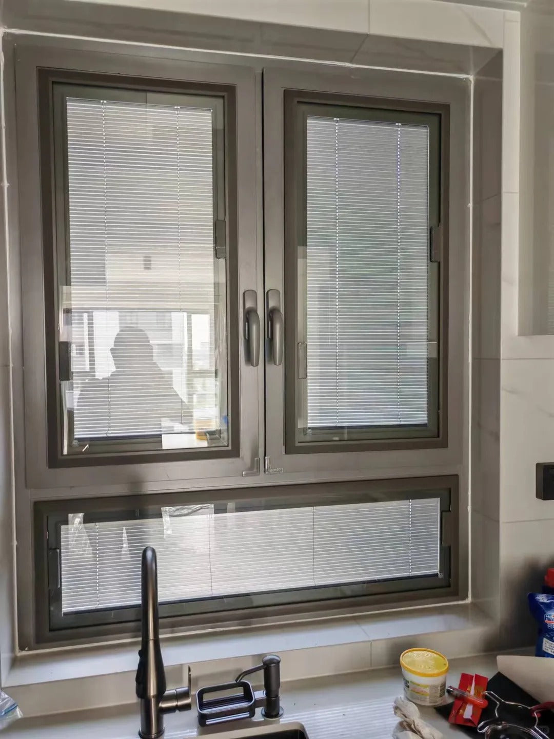 Rothnow UPVC vinyl tilt and turn window in black, 24x36 inches, showing open tilt and turn mechanism and sleek frame design.