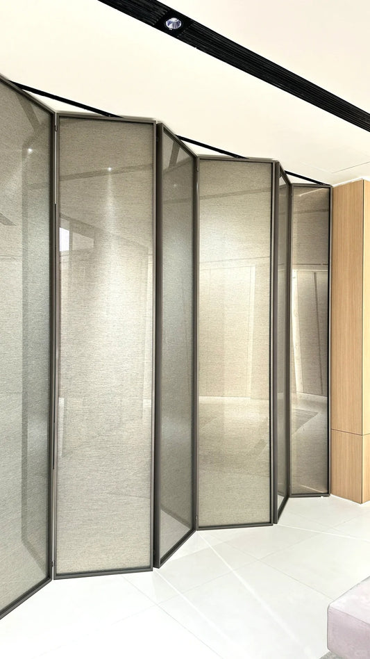 Rothnow aluminum bi-fold door with slim white frame and clear glass panels, 16x45 series folding door in a modern interior setting