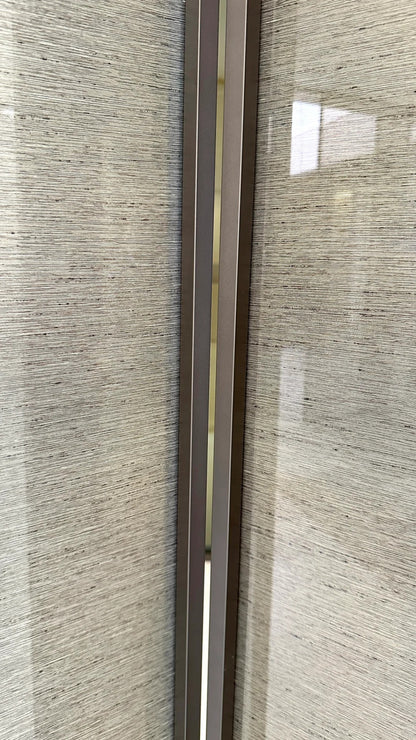 Rothnow® aluminum 16x45 series slim frame bi-fold folding door with clear glass and white finish, shown in open position.