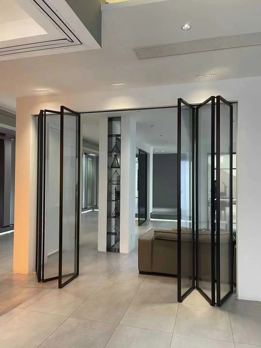 Rothnow Aluminum 16x45 Series Slim Frame Black Bi-fold Folding Door with clear glass, white skin, and black frame.