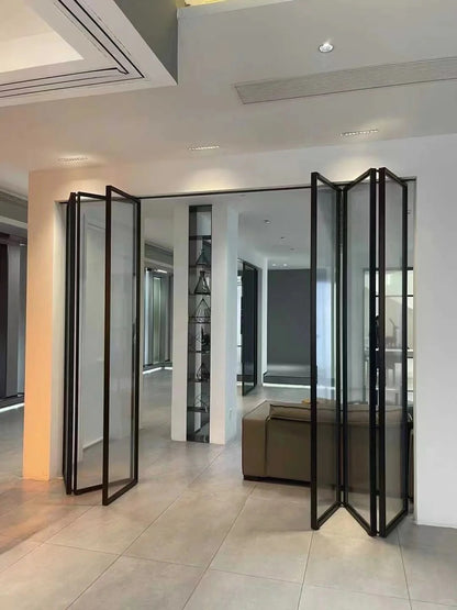Rothnow Aluminum 16x45 Series Slim Frame Black Bi-fold Folding Door with clear glass, white skin, and black frame.