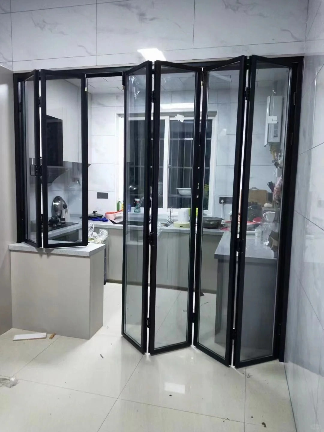 Rothnow Aluminum 16x45 Series Slim Frame Black Bi-fold Folding Door with clear glass, white frame, for modern interior or exterior use.
