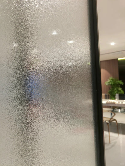 Rothnow aluminum 18x35 series slim frame bi-fold door with clear glass, white finish, for living room interior space.