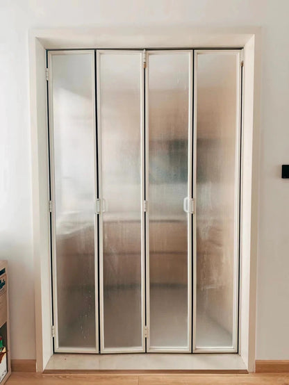 Rothnow Aluminum 18x35 Series Slim Frame Bi-fold Door with clear privacy glass, white finish, folding design, and sleek modern look.