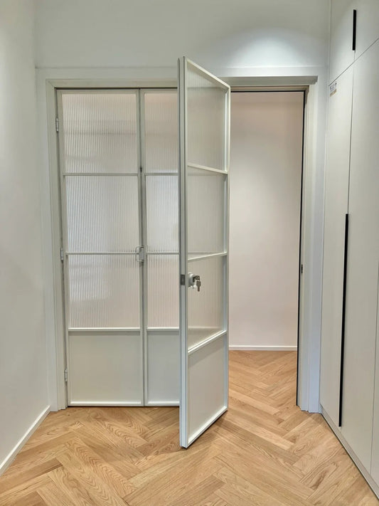 Rothnow French Style Aluminum Bi-fold Door with slim white frame and clear glass, 18x35 series for living room use.