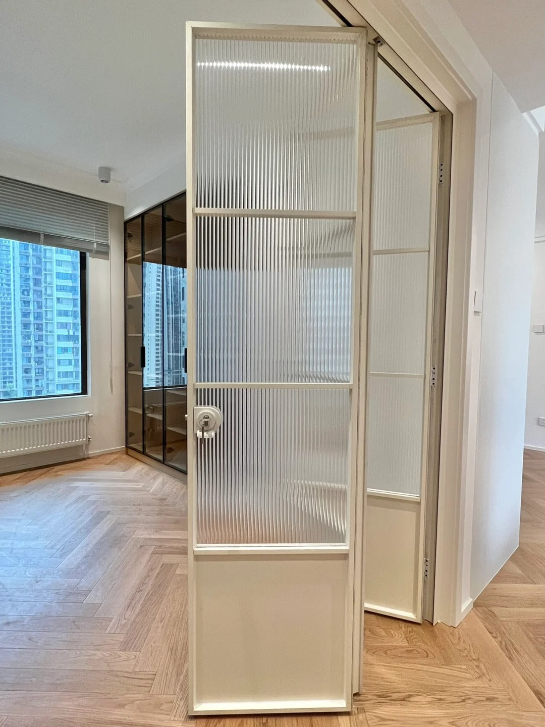Rothnow French Style Aluminum Bi-fold Door with clear glass, slim white frame, 18x35 series, for living room or interior use