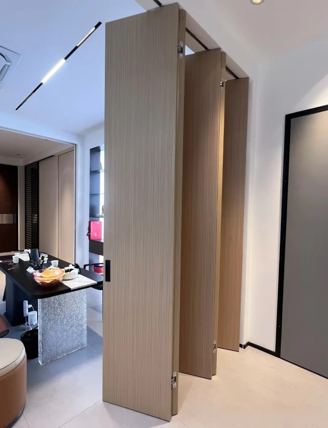 Rothnow Aluminum Wooden Folding Door in wood grain finish, 800mm wide by 2100mm high with 150mm wall thickness, ideal for interior spaces.
