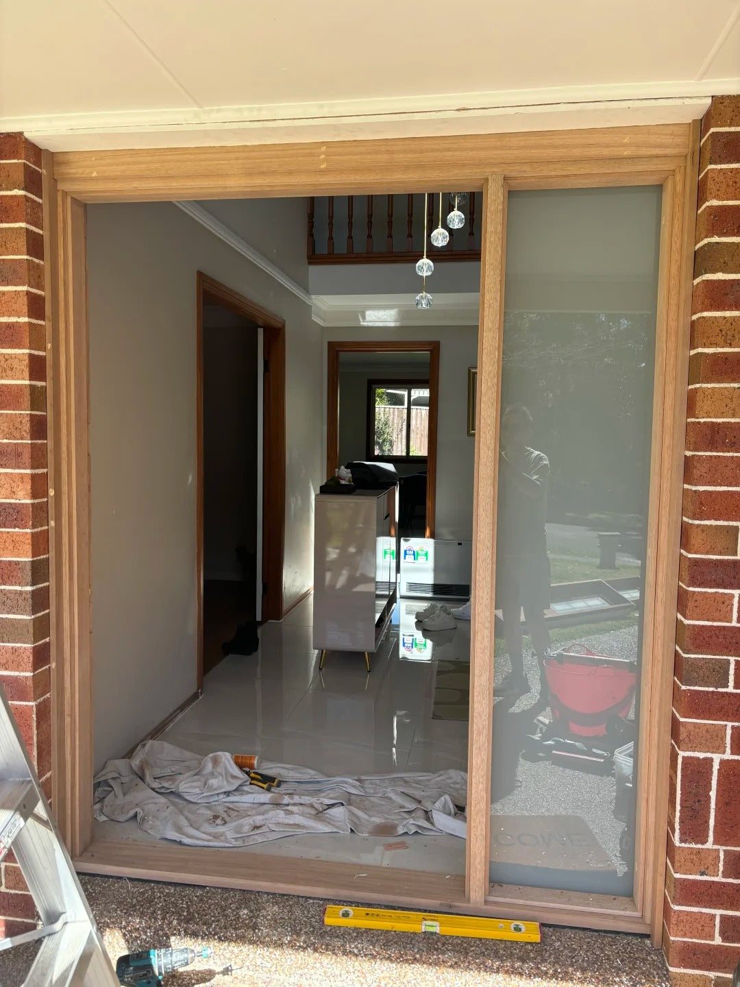 Rothnow wood front door with stainless steel accents, 800mm wide and 2100mm tall, featuring a brown finish and pivot design.