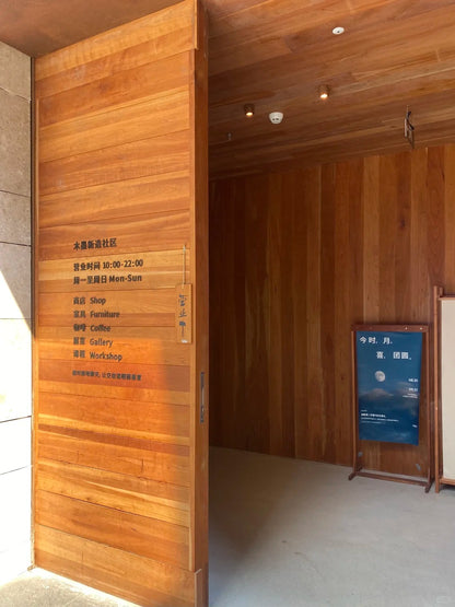 Rothnow wood front door with brown finish, pivot design, 800mm wide and 2100mm high, with 150mm wall thickness.