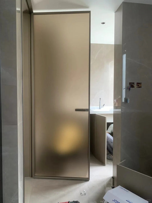 Rothnow aluminum door with 16x45 Series bronze wired glass, white frame, and clear glass panel.