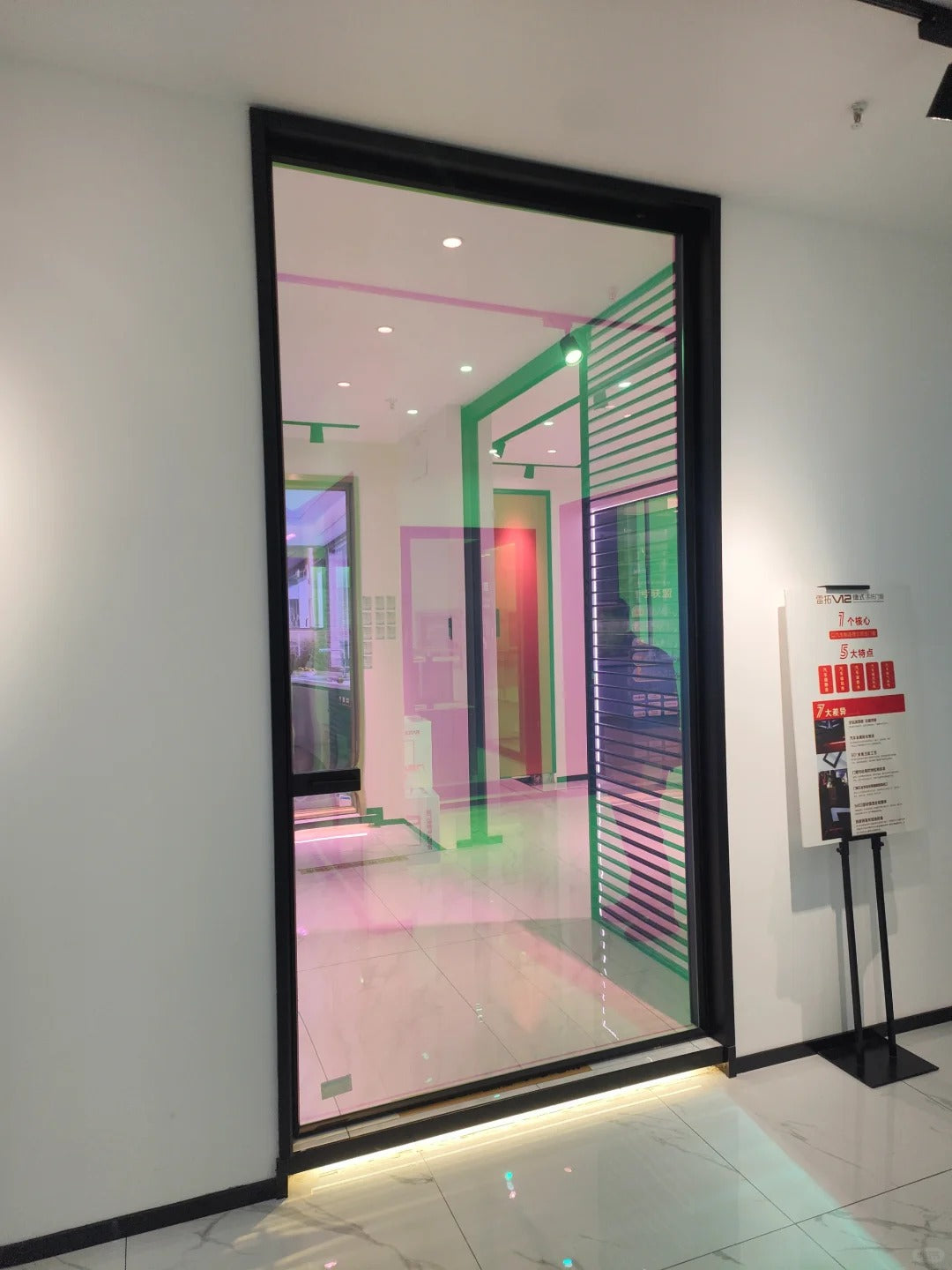 Rothnow aluminum 16x45 Series pivot door with clear glass skin, white finish, and neon glass design for modern entryways.