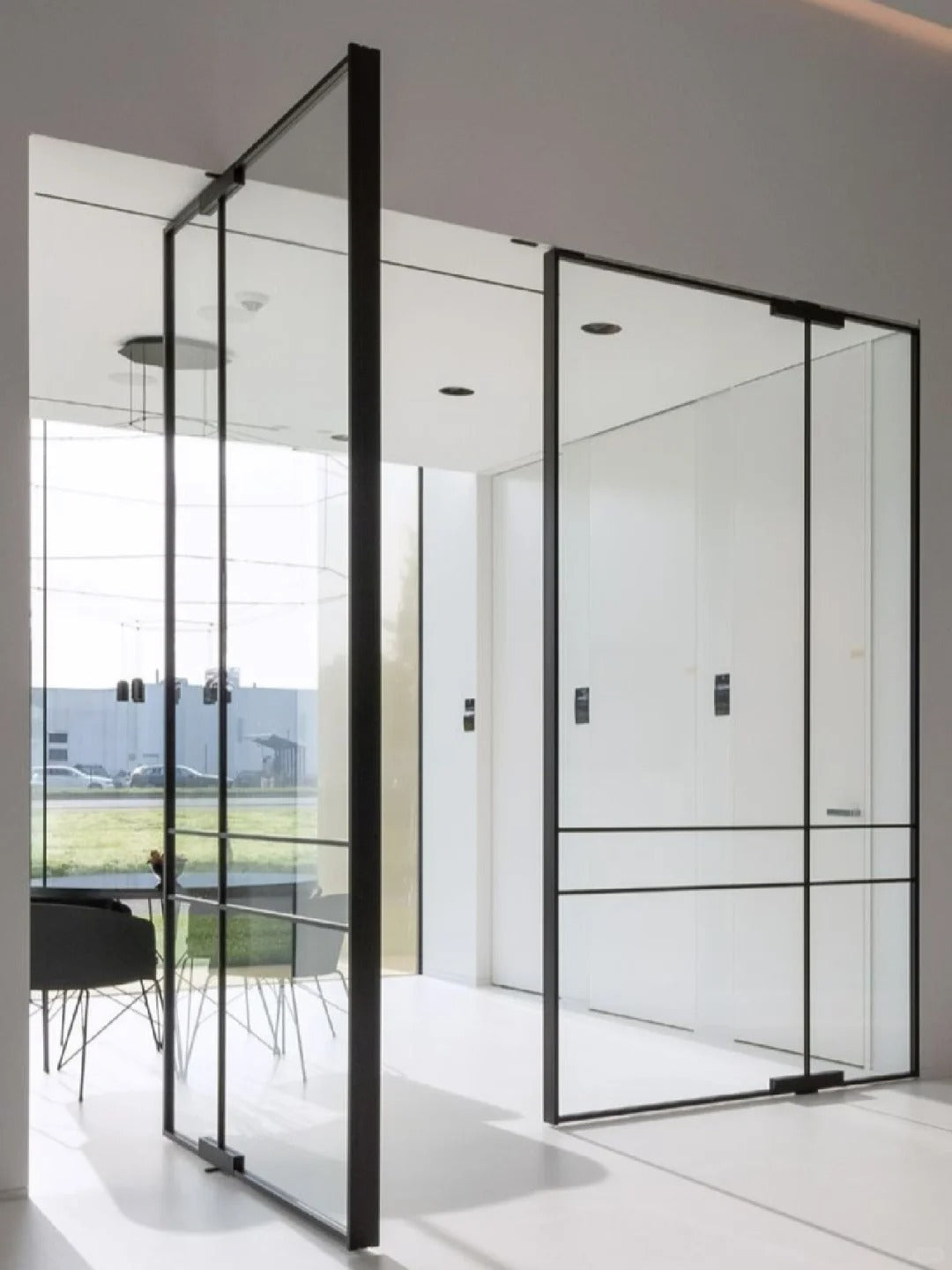 Rothnow aluminum 16x45 series pivot door with transparent glass and white frame, showing the sleek, modern design.