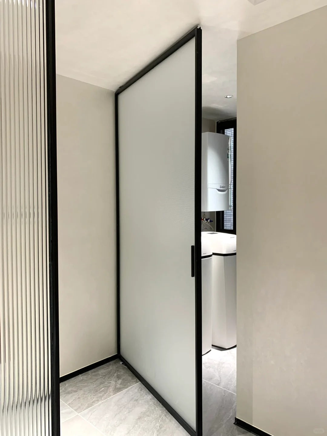 Rothnow Aluminum Pivot Door in White Oil Sand with clear glass, 16x45 series, featuring sleek modern design and robust construction.