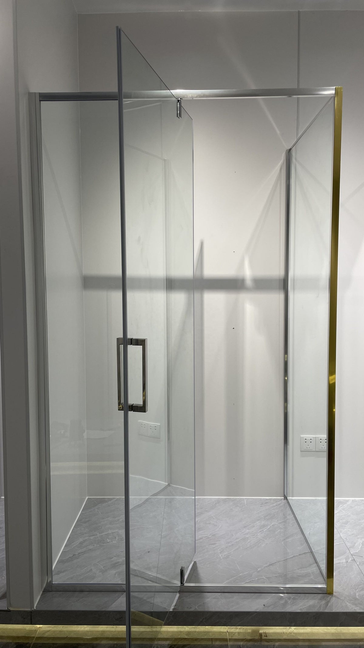 Rothnow® black-profile pivot shower door for shower panel, featuring sleek black framing and clear glass, measuring 900mm wide.