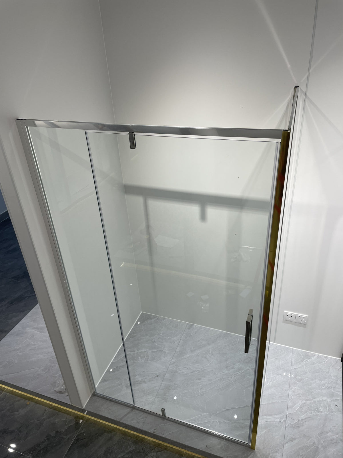 Rothnow black profile pivot shower door for shower panel, sleek modern design, 900mm width and 2200mm height.