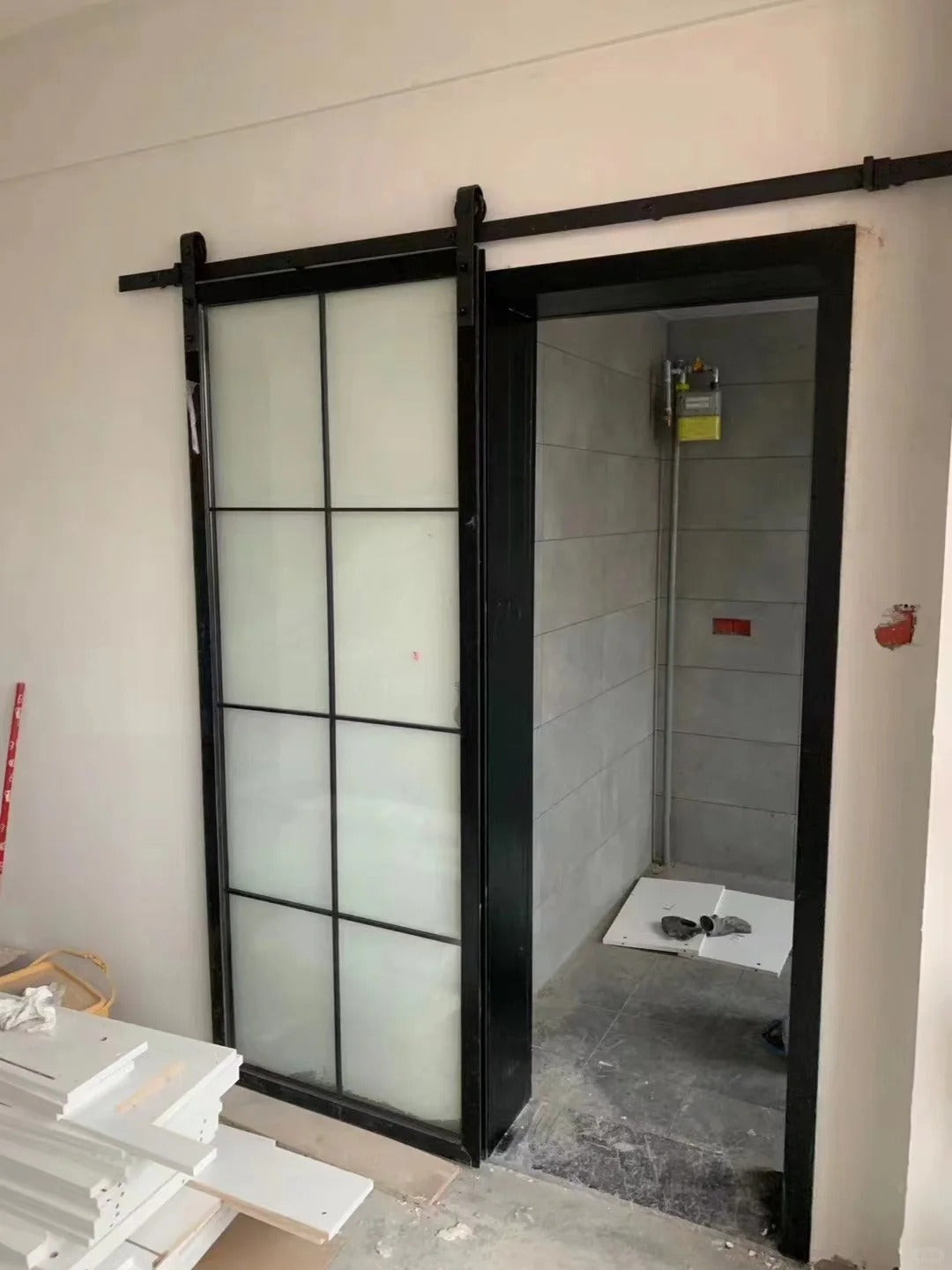 Rothnow® Aluminum Door 16x45 Series American Style Slim Frame Barn Door with clear glass and white finish in a modern interior setting