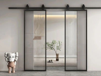 White Rothnow aluminum barn door with clear glass, 16x45 series slim frame American style for interior use.