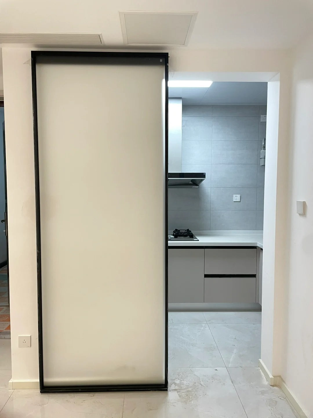 Rothnow® aluminum door with white oil sand finish, 16x45 slim frame ghost door, clear glass panel, modern door design.