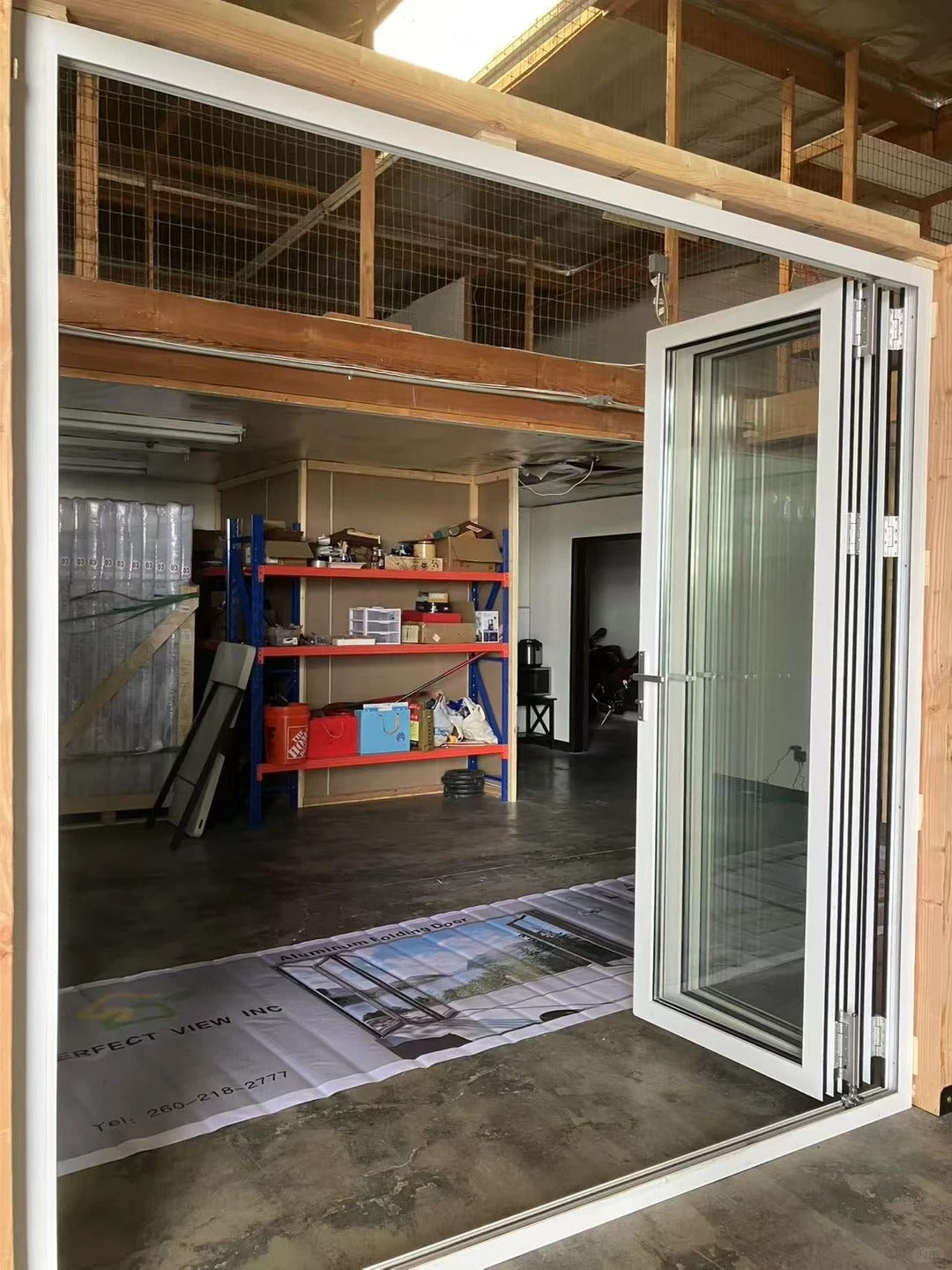 Rothnow vinyl folding UPVC door in black, 900mm wide x 2200mm high, with multiple panels and sleek design.