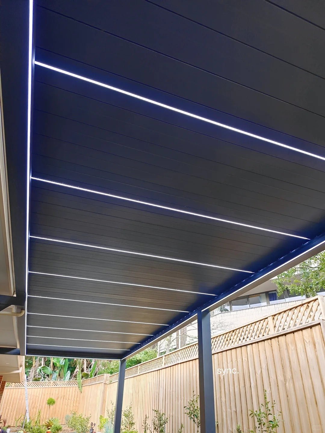 Black Rothnow aluminum pergola with sleek ceiling design, featuring customizable size and durable alloy construction for outdoor shading.