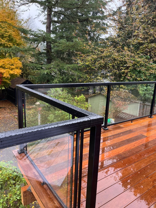 Black Rothnow aluminum glass railing RNAR02, custom size, modern safety barrier with sleek glass panels and aluminum frame.