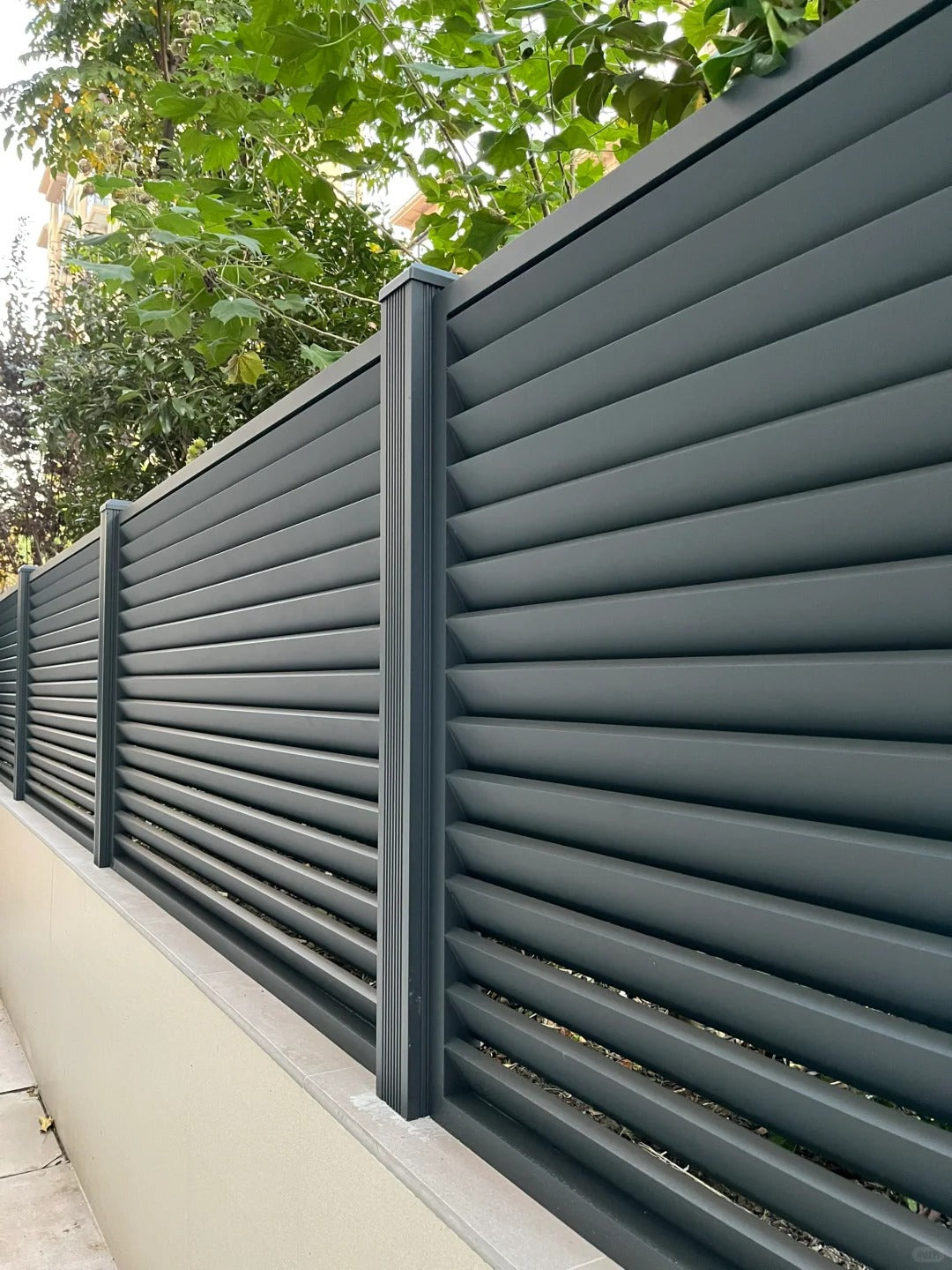 Black Rothnow aluminum railing and shutter fence with customizable size, featuring sleek horizontal slats and durable metal construction.