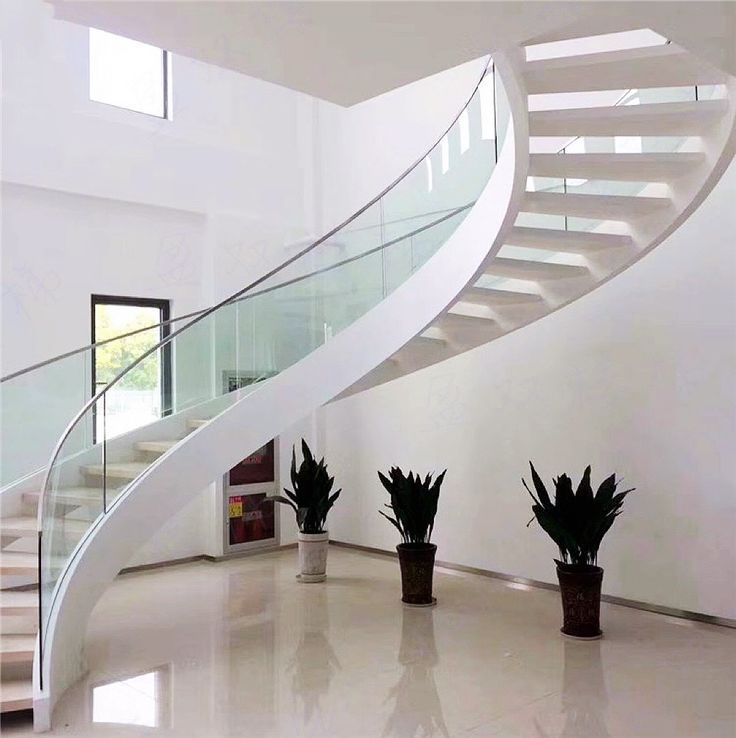 Rothnow® Curved Staircase RNCS04 with black finish and glass railing, showcasing a sleek, modern staircase design.