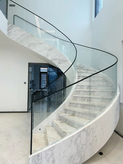 Rothnow® Curved Staircase RNCS05 made of stone, featuring a black finish and elegant curved design for stylish interior stairways.