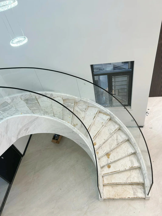 Rothnow® curved staircase with black stone finish, custom-sized staircase featuring elegant, modern design and sturdy construction.