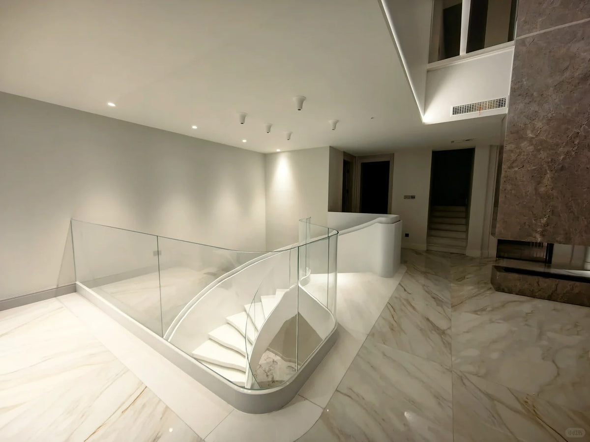 Black Rothnow Curved Staircase RNCS06 made of stone with a sleek, elegant design, featuring smooth curved steps and modern craftsmanship.