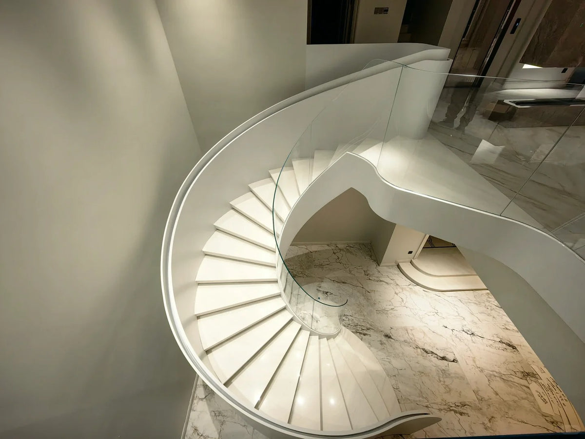 Rothnow® curved staircase in black with stone finish, custom-sized, showcasing elegant, modern design for interior stairs.