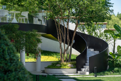 Black Rothnow curved outdoor staircase with sturdy railing and steps, designed for stylish exterior access.