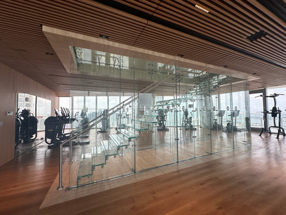 Black Rothnow® glass floating staircase with sleek steps and modern design, custom-sized for contemporary interior spaces.
