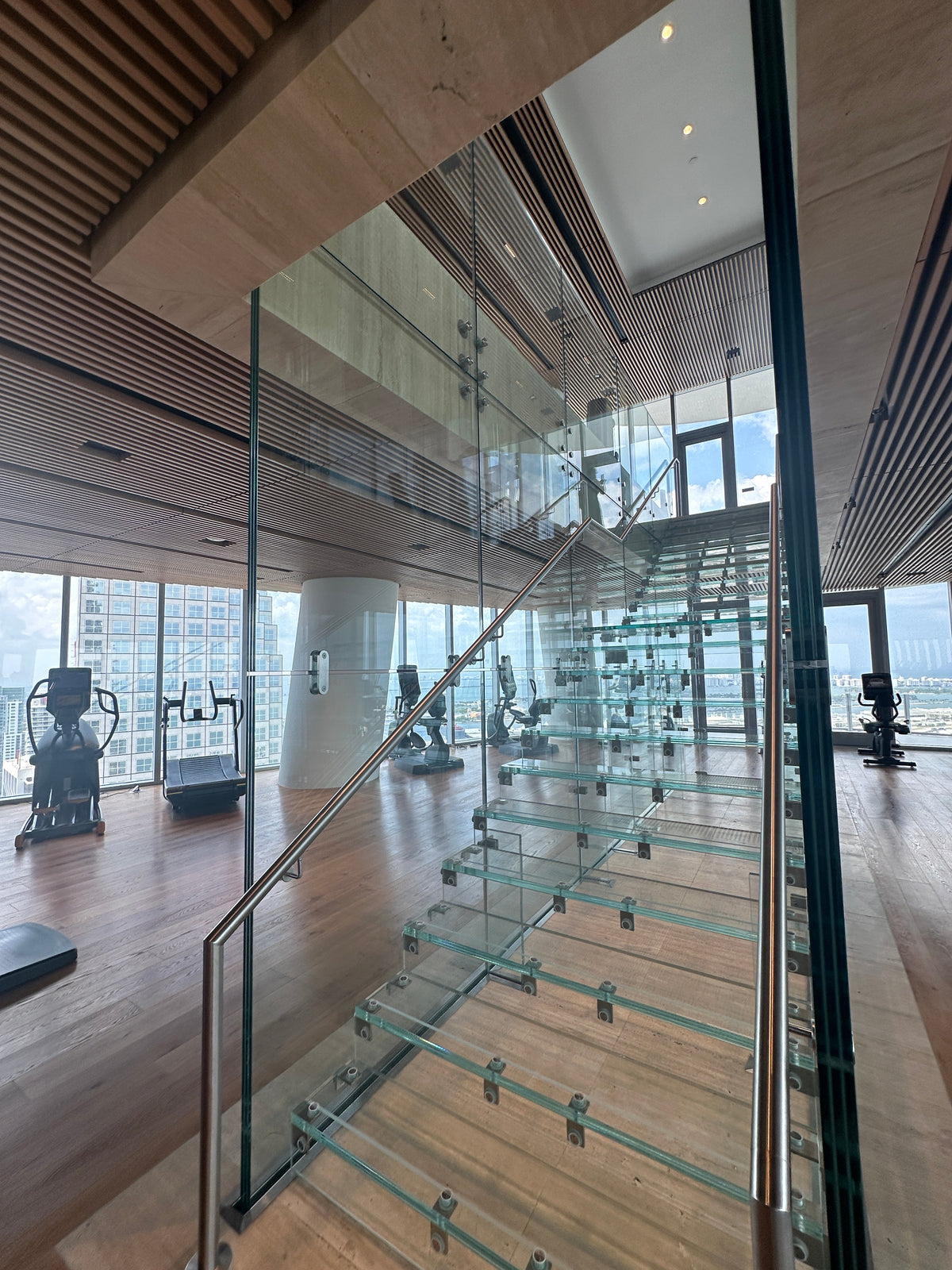Black Rothnow® glass floating staircase RNFS03 with sleek steps and modern design, showcasing a stylish interior staircase.